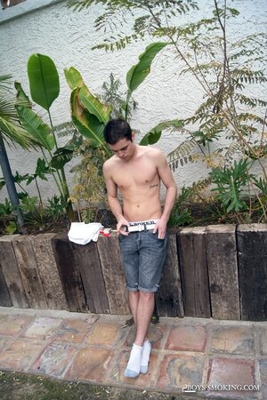 Dustin Fitch chainsmokes outdoors while stroking his big twink dick