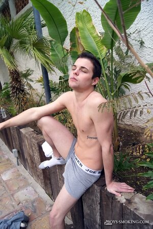 Dustin Fitch chainsmokes outdoors while stroking his big twink dick