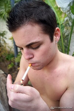 Dustin Fitch chainsmokes outdoors while stroking his big twink dick