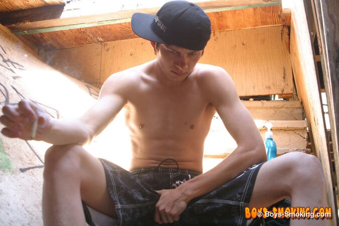 Skater boy Ian Madrox finds old porn mags and smokes while jerking his big cock