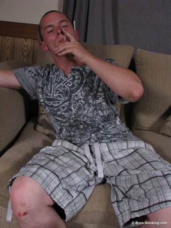 Dax chainsmokes while jerking his uncut cock