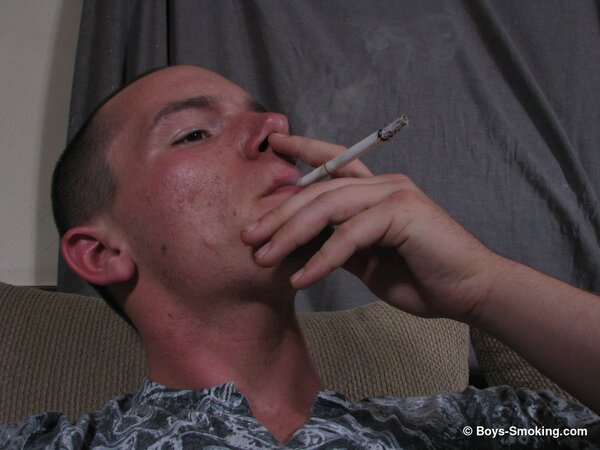 Dax chainsmokes while jerking his uncut cock