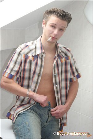 Blond euro boy Stone smokes on the washing machine and unloads on his abs