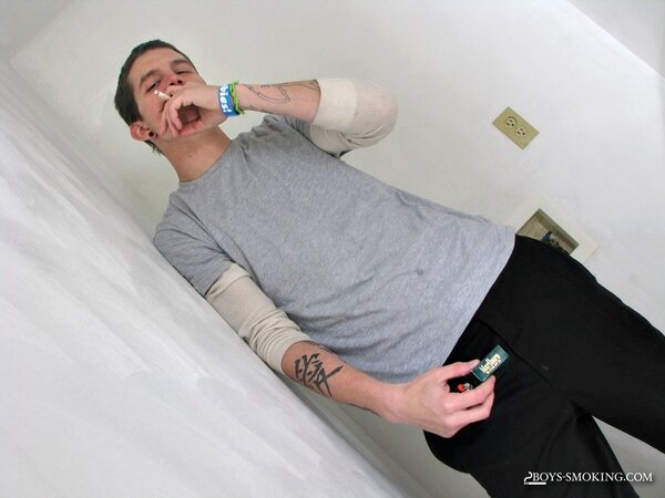 Lex smokes cigarette after cigarette while stroking his big nine inch dick
