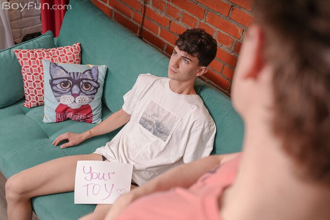 Andrew Abbott and Larry Wilson play with their favorite boy toy
