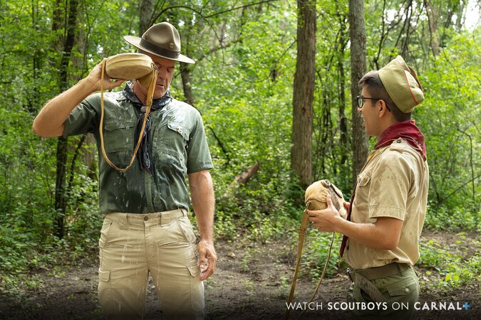 Scout Milo gets a very thorough outdoor shower from Scoutmaster Dillon Stone