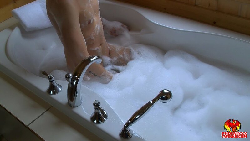 Zac Hunter slides anal beads inside his tight hole during a hot bath session