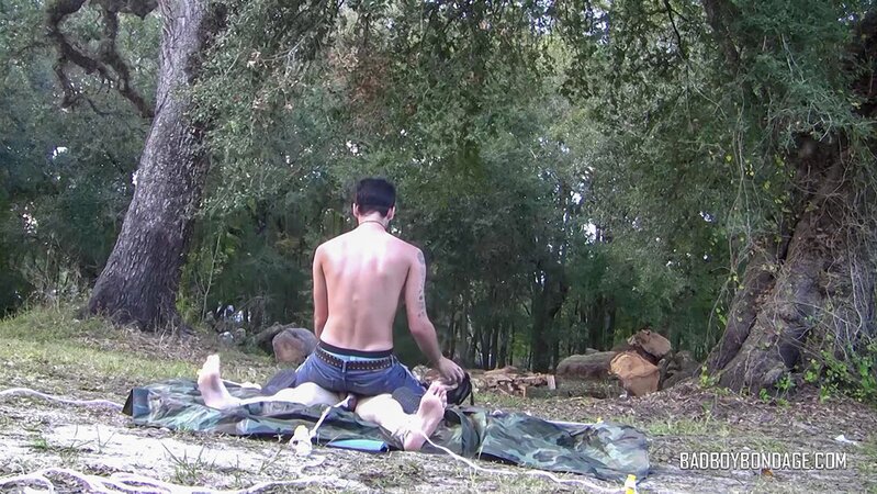 Dylan Frost ties up slim twink Jesse Lane for some intense outdoor BDSM