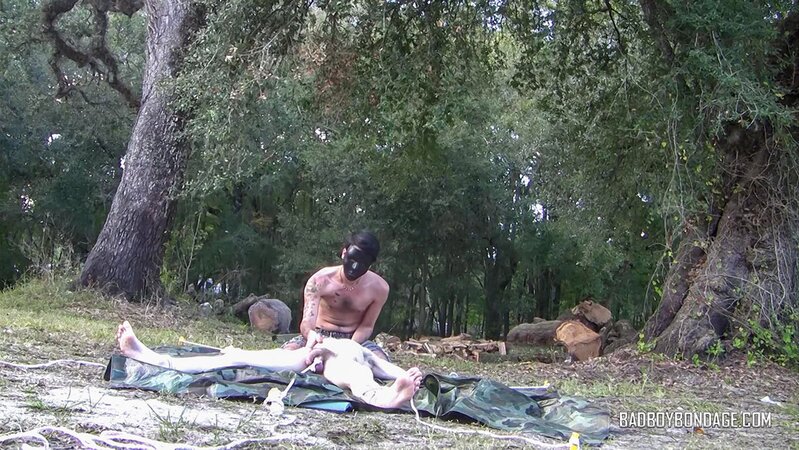 Dylan Frost ties up slim twink Jesse Lane for some intense outdoor BDSM