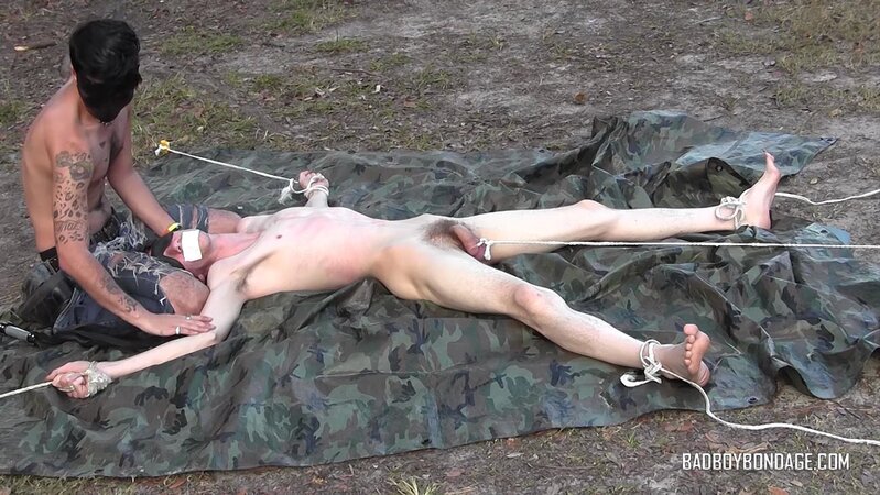 Dylan Frost ties up slim twink Jesse Lane for some intense outdoor BDSM