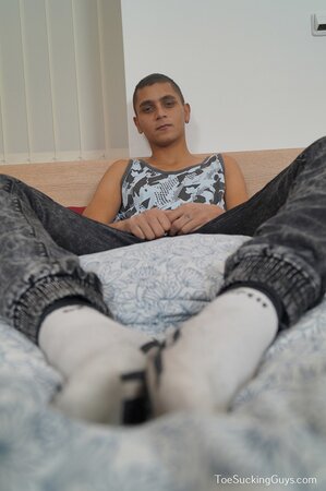 Slim young twink Eli Sterling strokes his smooth skin to a messy climax