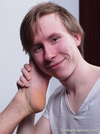 A slender young twink explores a kinky and intimate foot fetish play session