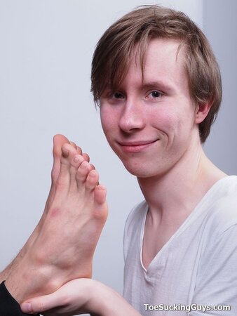 A slender young twink explores a kinky and intimate foot fetish play session