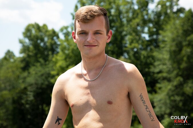 Cute twink JJ Jakobs shows off his massive cock in an outdoor hot tub