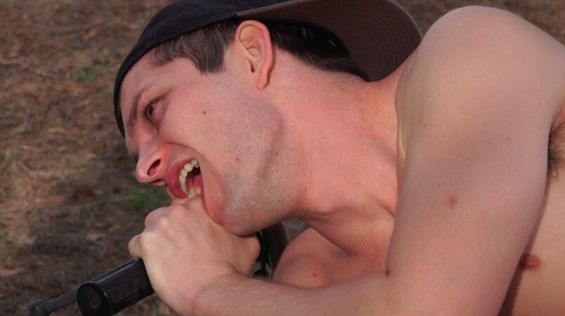 Seth Alexander feeds his huge nine inch cock down the throat of Mickey Knox