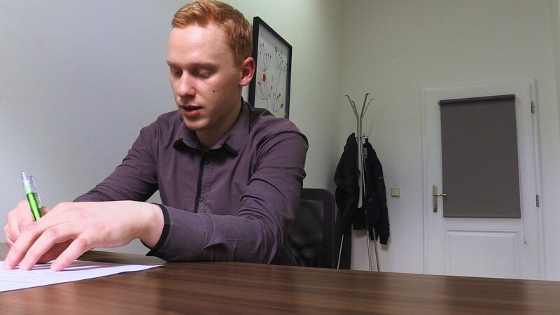 A shy ginger job seeker gets tested with a red dildo in the office