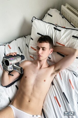 Cute twink Cain strokes his hard cock through his briefs in a solo
