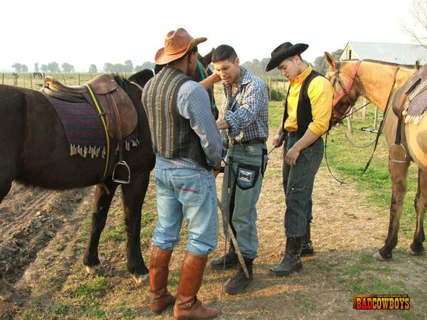 Two gay cowboys share skinny guy's ass