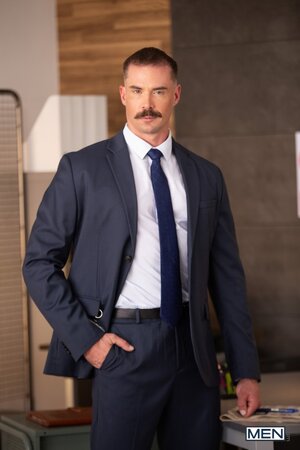 Security guard Beau Butler gives Adam Tyrant an intimate office search