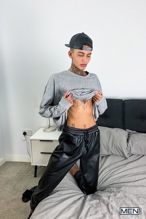 Tattooed twink Logan strips down to his jockstrap for a messy solo show