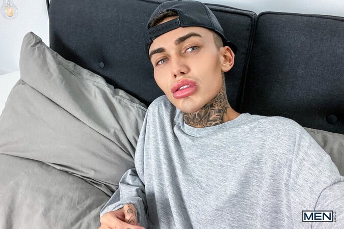 Tattooed twink Logan strips down to his jockstrap for a messy solo show