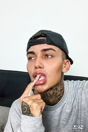 Tattooed twink Logan strips down to his jockstrap for a messy solo show