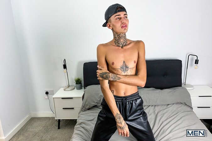 Tattooed twink Logan strips down to his jockstrap for a messy solo show
