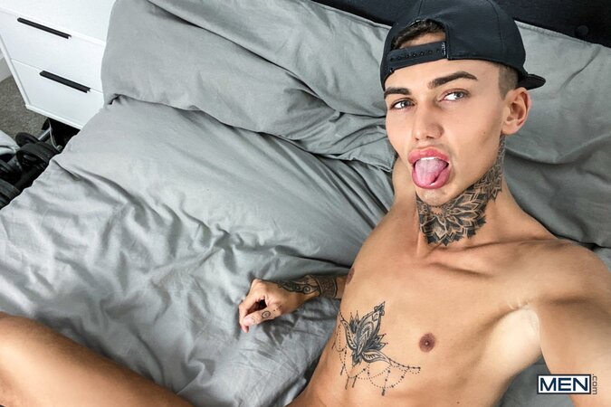 Tattooed twink Logan strips down to his jockstrap for a messy solo show