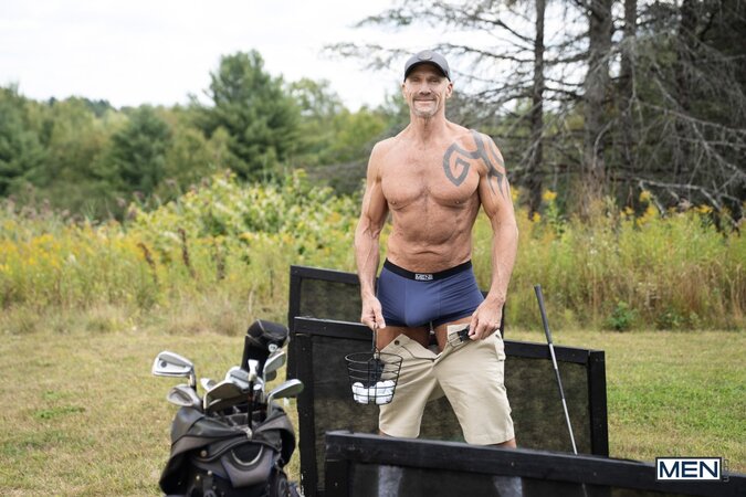 Dallas Steele shows Dick Dawson a different stiff shaft out on the golf course