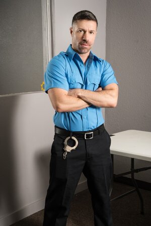 Tristan Jaxx handles Michael Jackman interrogation by bending him over the glass