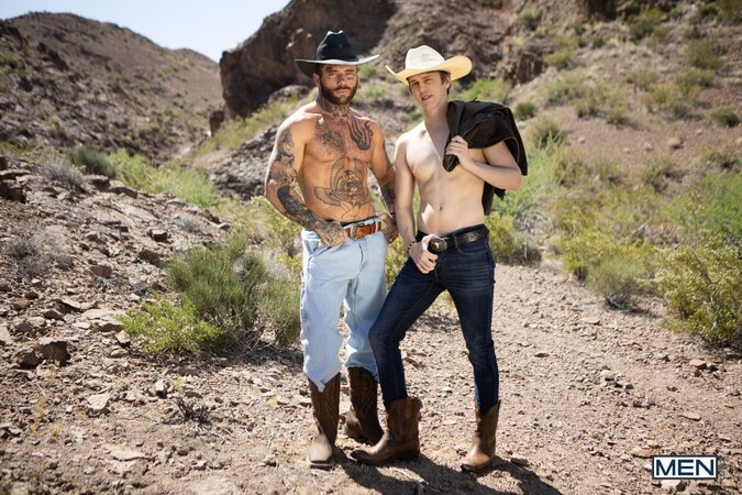 Cowboy Joel Hart drives into Sage Rouxe against the desert truck bed