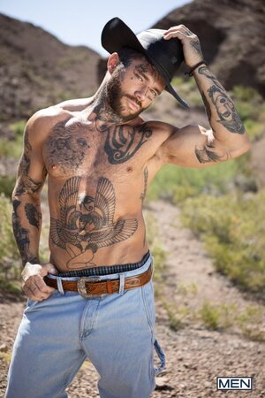 Cowboy Joel Hart drives into Sage Rouxe against the desert truck bed