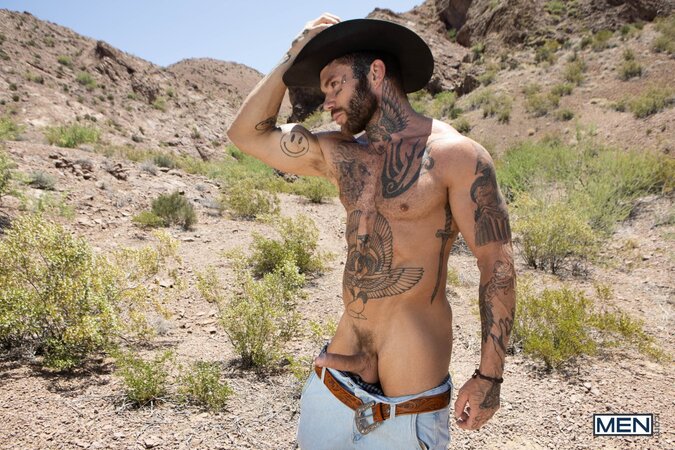 Cowboy Joel Hart drives into Sage Rouxe against the desert truck bed