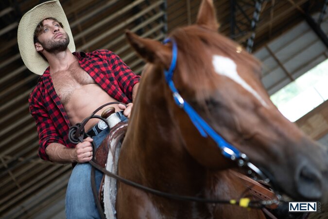 Cowboy Chuck Conrad takes a quick break to pound returning buddy Tim James