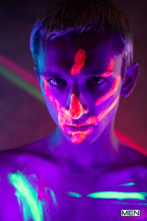 Theo Brady and Olivier Robert cover each other in neon paint during a rave fuck