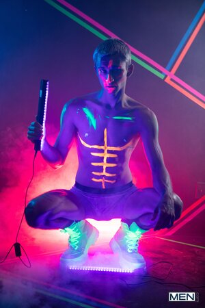 Theo Brady and Olivier Robert cover each other in neon paint during a rave fuck