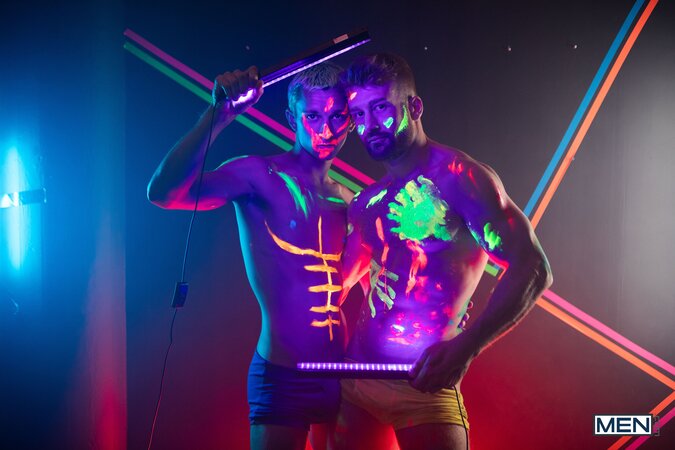 Theo Brady and Olivier Robert cover each other in neon paint during a rave fuck