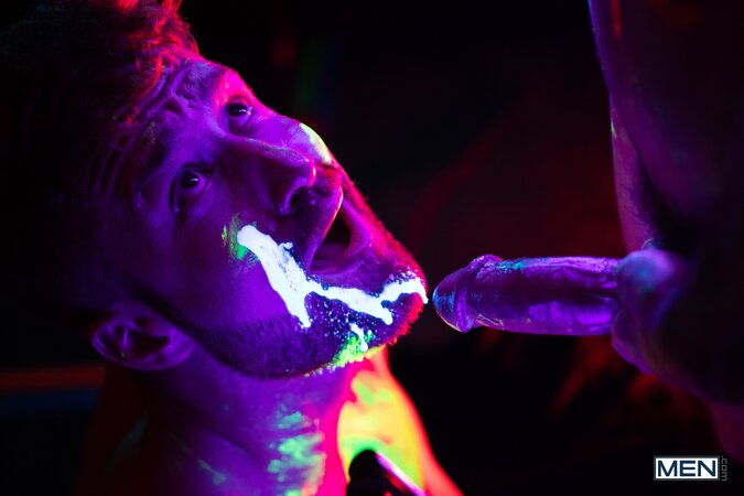 Theo Brady and Olivier Robert cover each other in neon paint during a rave fuck