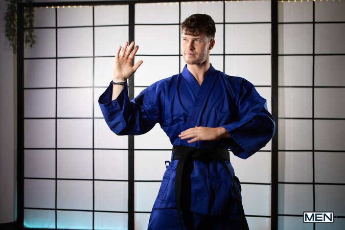 Sensei Finn Harding uses advanced martial arts moves to drill student Presley Scott