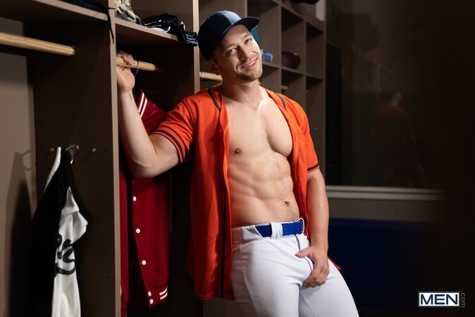 Coach Johnny Donovan gives player Damian Night a wild hands-on locker lesson