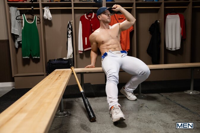 Coach Johnny Donovan gives player Damian Night a wild hands-on locker lesson