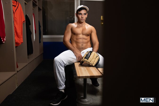 Coach Johnny Donovan gives player Damian Night a wild hands-on locker lesson