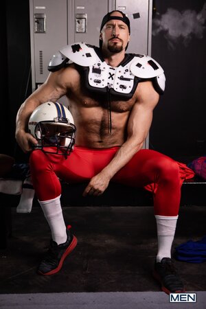 Towel boy Ryan Bailey dries off muscled football player Travis Connor with his ass