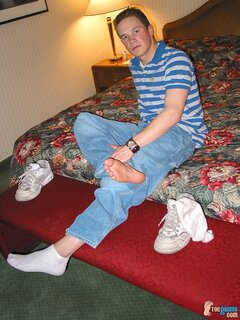 Tommy shows off his sneakers and socks