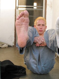 Mikko shows off his dirty socks and feet