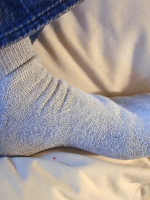 David teases with his smelly sport socks and playful feet