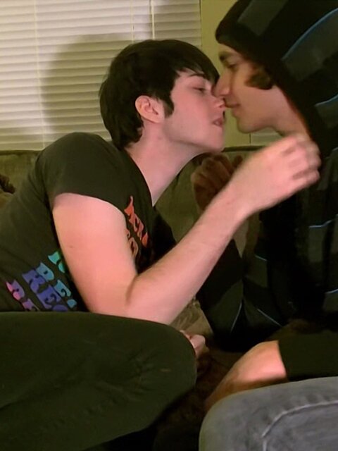 Tristan and Aron share a romantic kiss while touching feet