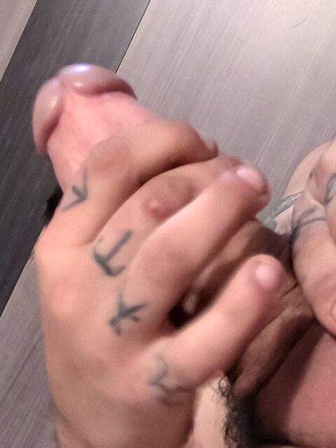 Tattooed twink Chad Turner shows off his bare feet while jacking off