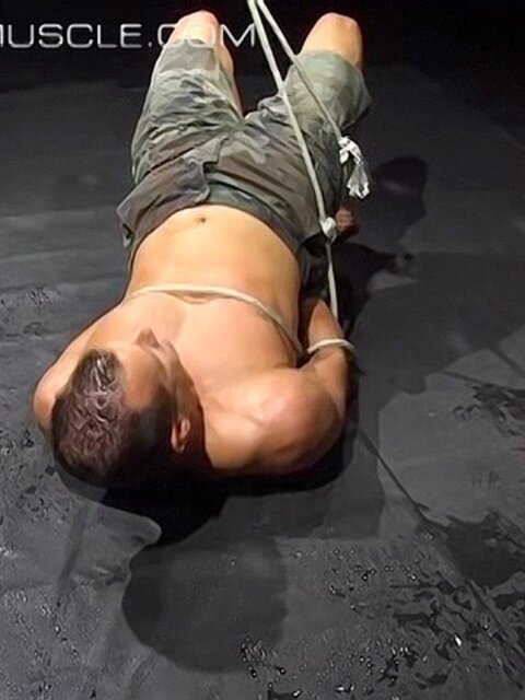 Hogtied Joseph Draggon fights for freedom from his restraints