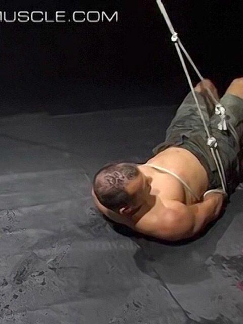 Hogtied Joseph Draggon fights for freedom from his restraints